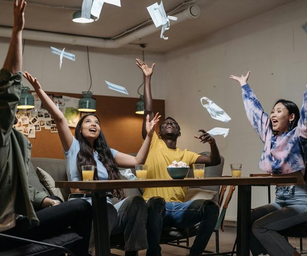 Group of diverse people smiling and relaxing after a workout session.